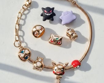 Pokemon Charms and Bracelet, Gold – Pikachu, Charmander, Eevee, Gengar, Snorlax, Poke Ball & More – Pokémon Jewelry Gift