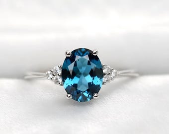 Oval London Blue Topaz Ring with Diamond Accent in Sterling Silver