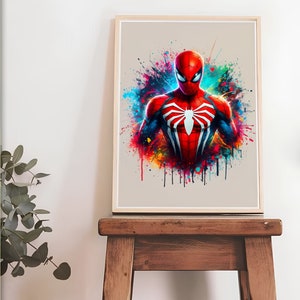 Puede incluir: Una impresi&oacute;n de arte digital que presenta a un superh&eacute;roe con un traje rojo y azul con un logotipo de ara&ntilde;a. El fondo es una salpicadura de pintura colorida.