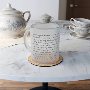 May include: A frosted glass mug with a black inscription that reads "Why is it always the one I never expected to grow to catch it heart on my sleeve baby it's me hoping you see this puzzle piece fitting so perfectly just you on the edge oh won't you play for me we ain't even on the couch your's I don't even care of silence I want to know if you'll stay too when I pray you with you if I don't even care of you I want to say with you when you say in you're my words so carefully tell me why I never be I never wanted to catch you with a mouse and if I go I want to go with you pray you know I'll be praying for you"