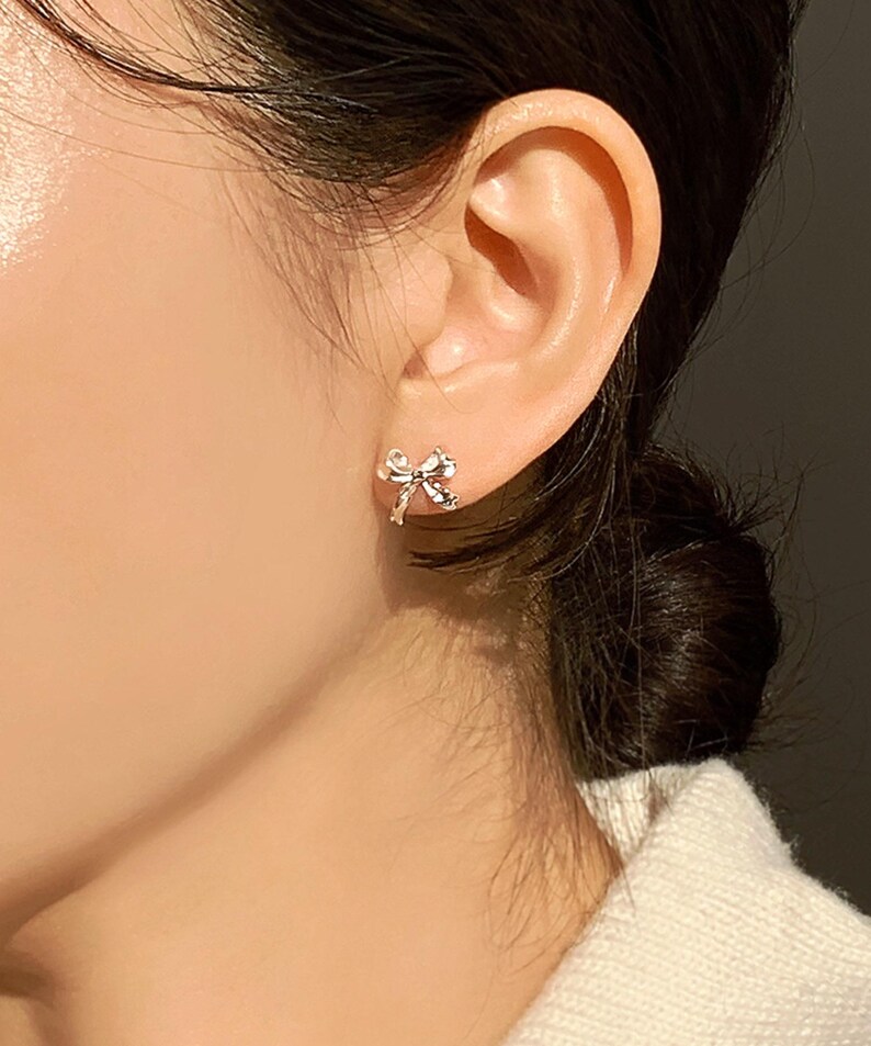 Delicate silver bow earrings for women