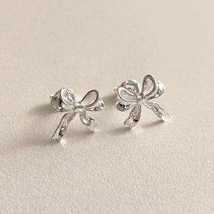 Small dainty bow earrings in sterling silver