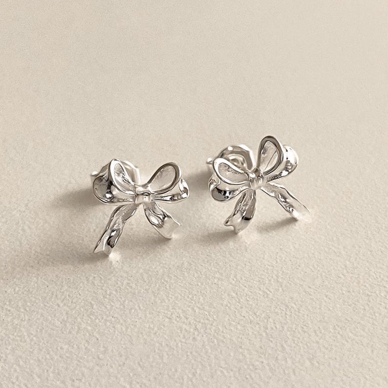 Small dainty bow earrings in sterling silver