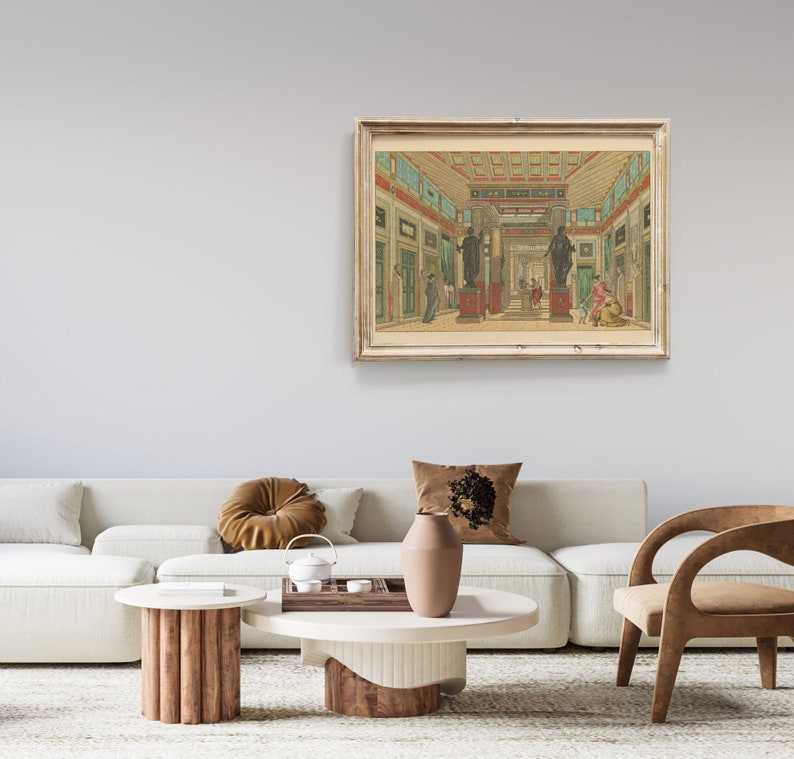 May include: A framed print of a vintage illustration depicting an interior scene of a grand hall with columns, arches, and statues. The hall is decorated with red and green accents, and the floor is tiled. The print is in a light wood frame.