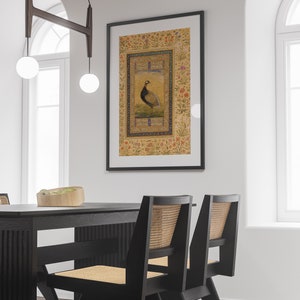May include: A framed print of a detailed illustration of a bird with a floral border. The bird is brown and white with a long tail. The border is a light yellow with pink, red, and blue flowers.