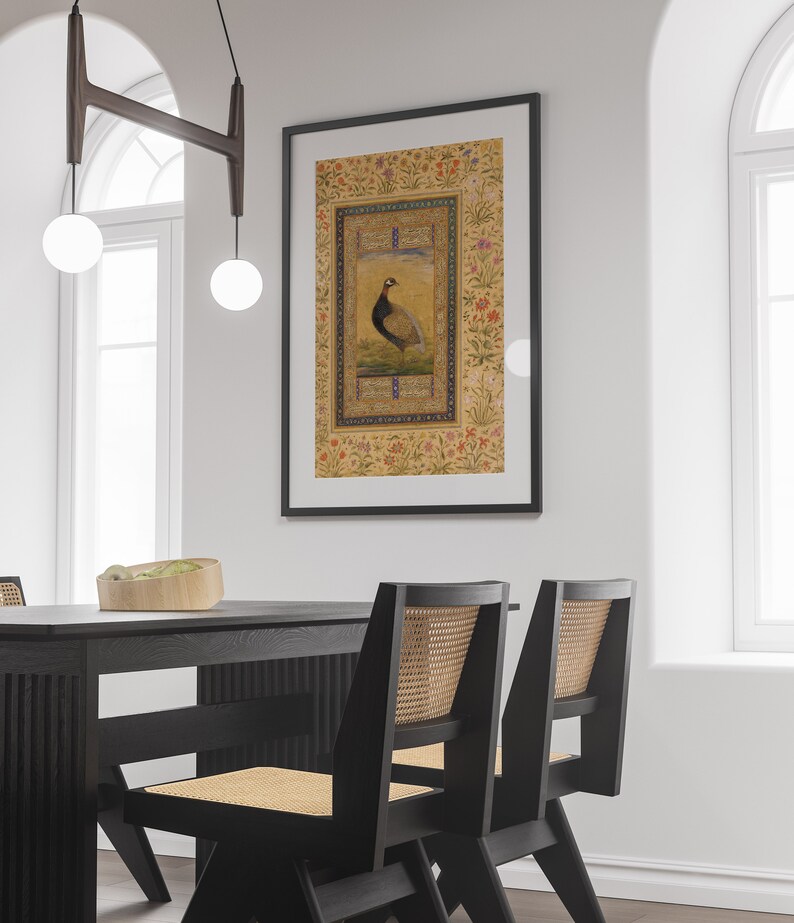 May include: A framed print of a detailed illustration of a bird with a floral border. The bird is brown and white with a long tail. The border is a light yellow with pink, red, and blue flowers.