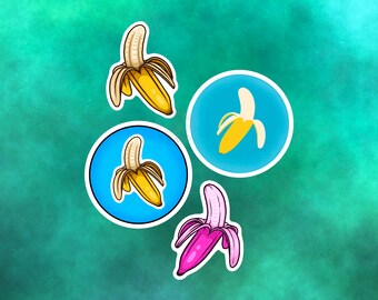 以下が含まれることがあります： バナナのイラストが描かれたステッカーが4つあります。ステッカーは緑色の背景に貼られています。バナナは黄色、ピンク、白です。