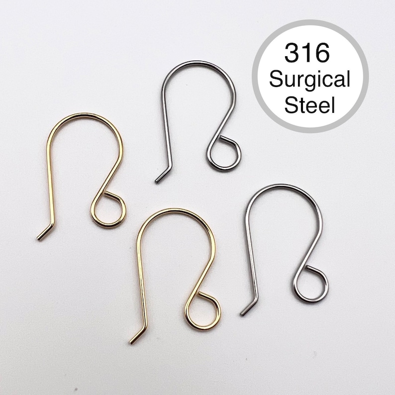 May include: Four earring hooks in different finishes: gold, silver, and two in stainless steel. The stainless steel hooks are labeled "316 Surgical Steel".