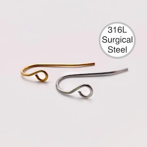 May include: Two earring hooks, one gold and one silver, made of 316L surgical steel.  The hooks are curved and have a small loop at the end.