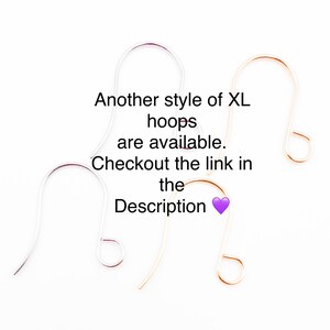 May include: Three different styles of earring hoops. The hoops are silver, gold, and rose gold. The text reads "Another style of XL hoops are available. Checkout the link in the Description."
