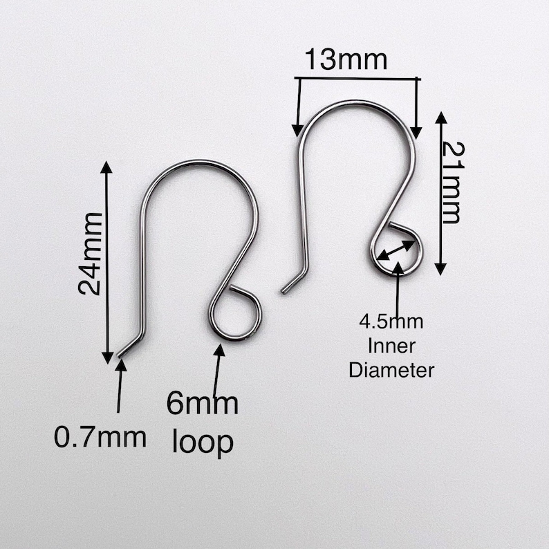 May include: Two silver earring hooks with a 24 mm length, 13 mm width, and 6 mm loop. The inner diameter of the hook is 4.5 mm. The hook is 0.7 mm thick.