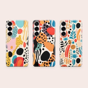 May include: Three smartphone cases featuring abstract patterns with colorful shapes including black dots, red circles, orange blobs, and blue foliage motifs. Each case has a vertical camera cutout on the left side with three circular lenses visible.