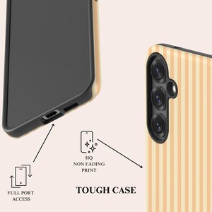 May include: A tough phone case featuring a light beige and cream vertical striped pattern. The case has a black interior frame, a triple camera cutout, and bottom port openings. Text labels include FULL PORT ACCESS and HQ NON FADING PRINT.