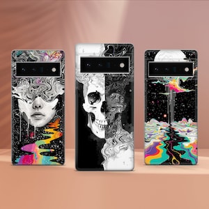 May include: Three phone cases with different designs. The first case features a black and white illustration of a skull and swirling patterns. The second case has a black and white illustration of a woman's face with swirling patterns. The third case has a black background with a colorful, abstract design.