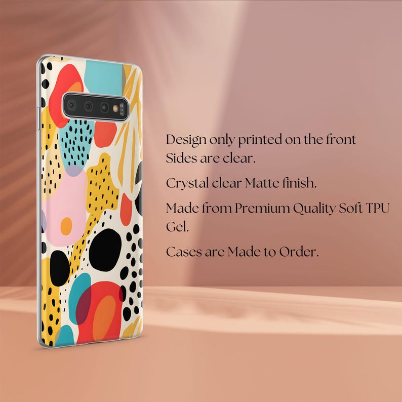 May include: A clear soft TPU gel phone case featuring a colorful abstract pattern of red, yellow, blue, and black shapes on the back. The text reads: Design only printed on the front. Sides are clear. Crystal clear Matte finish. Made from Premium Quality Soft TPU Gel. Cases are Made to Order.