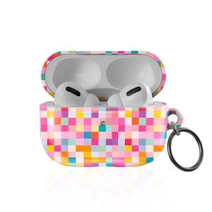 May include: A white wireless earbud charging case with an open lid, featuring a colorful pixelated square pattern in shades of pink, yellow, orange, blue, and purple. A black metal circular keychain ring is attached to the side of the case.