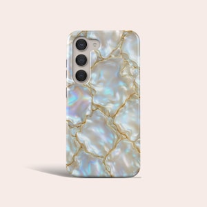 May include: A smartphone case with a pearlescent, iridescent design. The case features a white and gold cracked pattern, with a triple-lens camera array on the upper left. The case has a smooth, glossy finish.