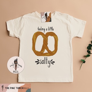 pretzel kids tee, feeling salty pretzel pregnancy announcement, pretzel NY kids clothing, cute pretzel baby shirt, pretzel kids shirt