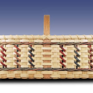 May include: A woven basket with a natural wood handle and a decorative pattern of red, blue, and brown woven into the basket.