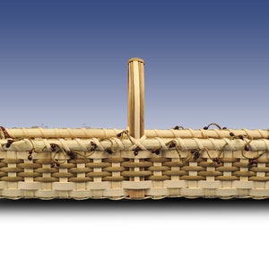 May include: A rectangular woven basket with a handle and fabric lining. The basket is made of natural wood and has a light brown color. The fabric lining is red and white with a plaid pattern.
