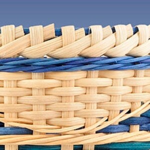 May include: Close-up of a woven basket with a natural brown color and blue and teal accents. The basket is made with a tight weave and has a smooth, polished finish.