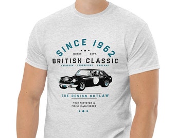 May include: A heather grey t-shirt with a vintage-inspired design featuring a black and white illustration of a classic British sports car. The text on the shirt reads "Since 1962 British Classic The Design Outlaw".