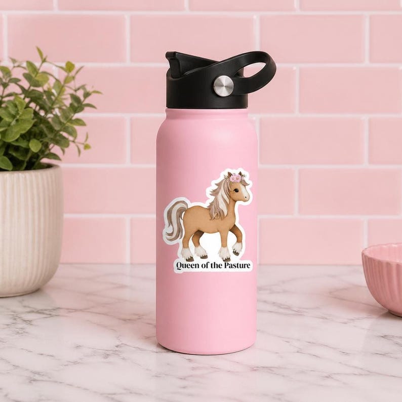 Waterproof horse sticker displayed on a pink water bottle, showing a floral crown pony with “Queen of the Pasture,” ideal for horse lovers decorating tumblers and everyday drinkware.