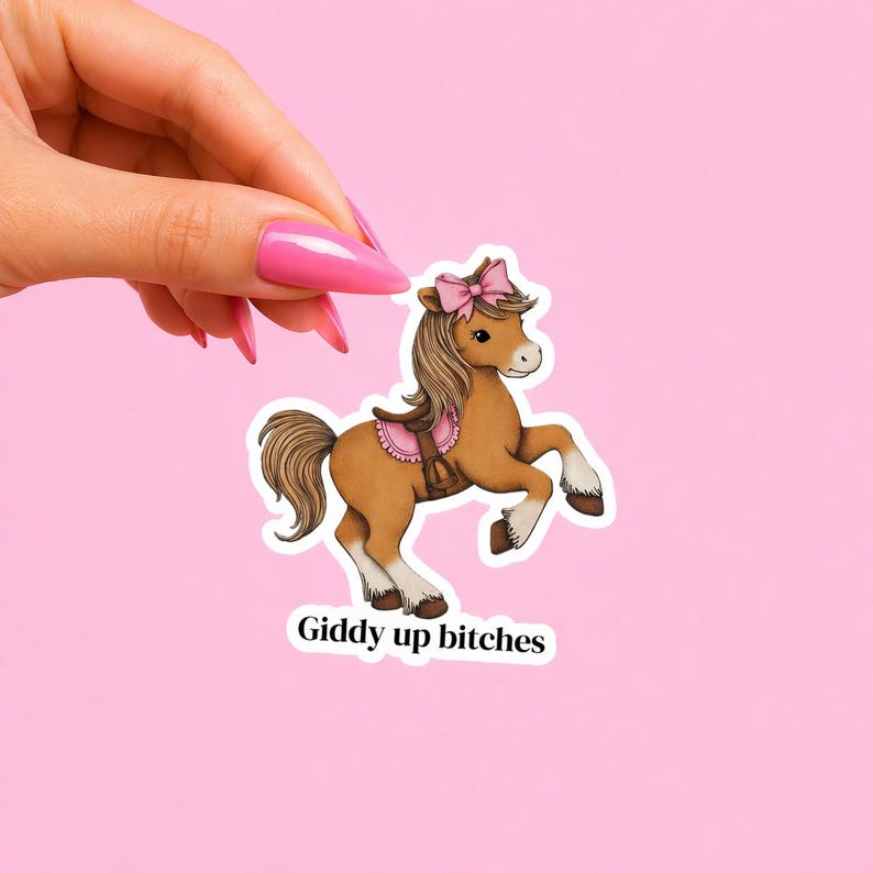 Funny horse sticker featuring a cute retro-style pony with a pink bow and the phrase “Giddy up bitches,” perfect as a horse lover gift. This playful vinyl sticker is great for decorating water bottles, laptops, journals, phone cases, or planners with a sassy, vintage-inspired touch.