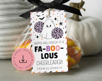 May include: A clear plastic treat bag filled with candy corn, tied with a black ribbon and a rectangular paper tag. The tag features a ghost, pom-poms, and the text: Happy Halloween to a FA-BOO-LOUS CHEERLEADER! From Elizabeth. Includes a pink Canva icon.