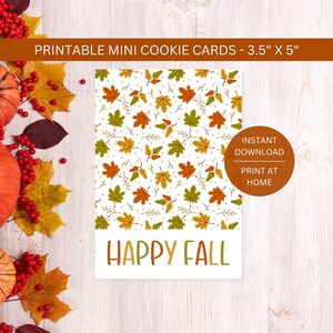 May include: A white card with a fall leaf pattern and the words "HAPPY FALL". The card measures 3.5" x 5" and has a circular "INSTANT DOWNLOAD" graphic. The top banner reads "PRINTABLE MINI COOKIE CARDS".