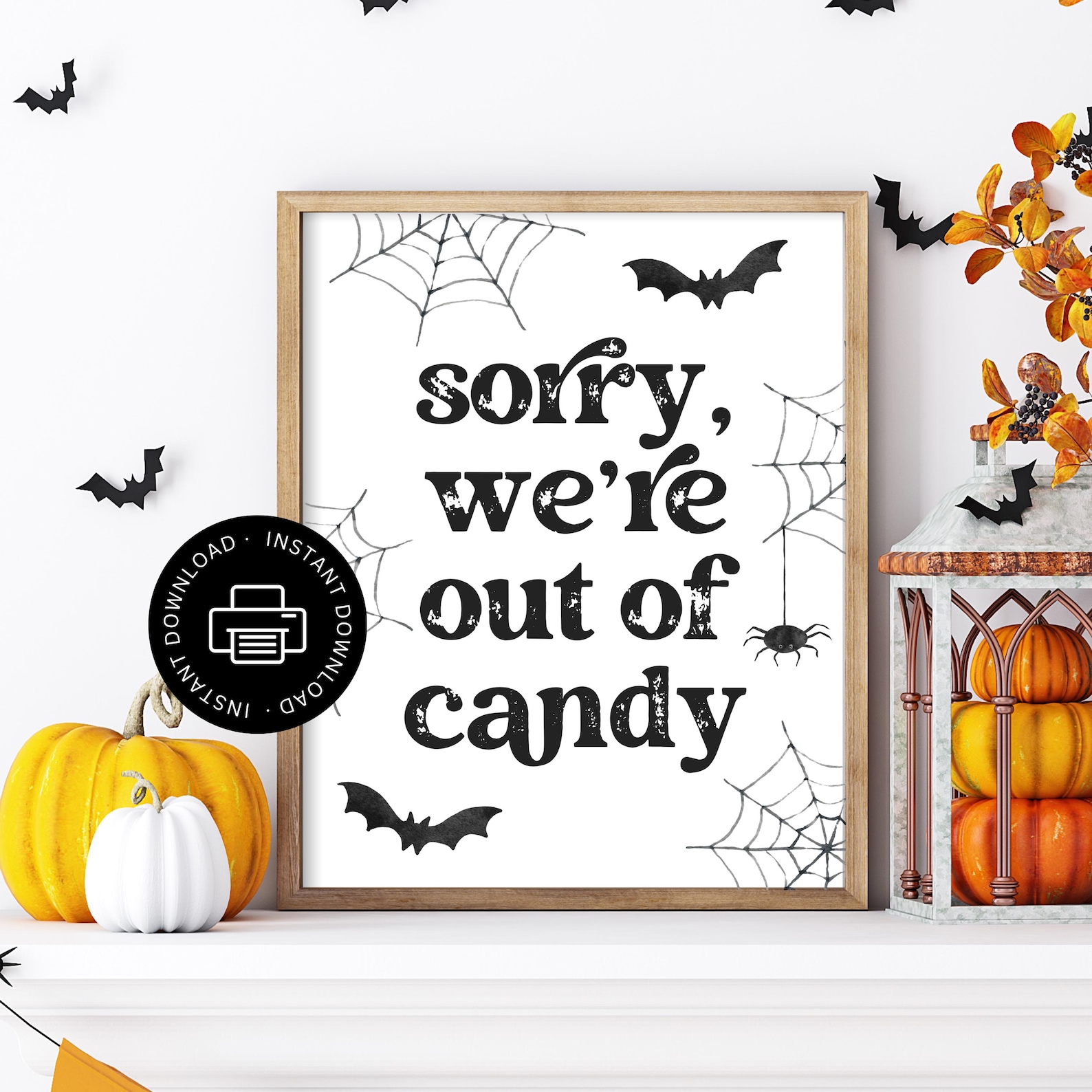 A Simple Sorry-We’re-Out-of-Candy Sign White framed out-of-candy sign with small bats, webs and autumn leaves.