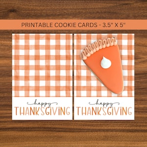 May include: Printable cookie cards, 3.5" x 5", feature a pumpkin pie slice design. The cards have an orange and white gingham pattern background. The words "happy THANKSGIVING" are printed in black and orange.