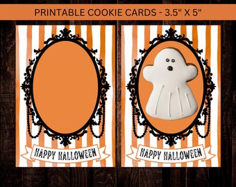May include: Printable Halloween cookie cards, 3.5" x 5", with an orange and white striped background. One card features a blank oval frame, the other a ghost cookie. Both cards have a black ornate frame and a "Happy Halloween" banner.
