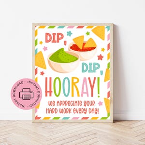 May include: A framed print with a colorful design featuring the words "DIP, DIP, HOORAY!" and the phrase "We appreciate your hard work every day!" The image includes illustrations of chips, guacamole, and salsa.