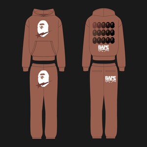 May include: Brown hoodie and sweatpants set. The hoodie features a white graphic of a cartoon ape head with a lightning bolt. The sweatpants also have the ape head graphic. The back of the hoodie has multiple ape head graphics and the text "BAPE".