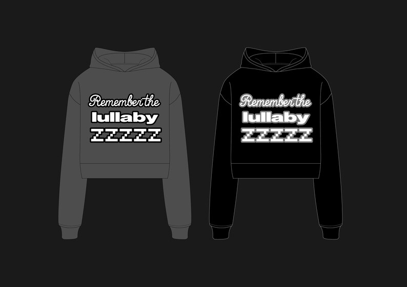 May include: Two hooded sweatshirts, one dark gray and one black, displayed side-by-side. Each features the text "Remember the lullaby" above "ZZZZZ" in a white, stylized font. The sweatshirts have a cropped design.