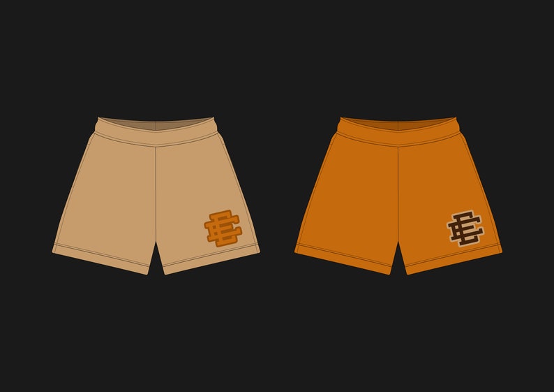 Puede incluir: Dos pares de pantalones cortos deportivos, uno de color beige y otro naranja, con un logotipo bordado en marr&oacute;n en la pierna derecha.