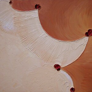 May include: Abstract painting with a white and orange background. The white area has a textured, fan-like pattern. There are five small red circles in the upper right corner of the painting.