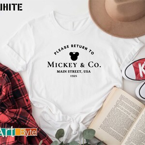 a mickey mouse shirt that says please return to mickey and co