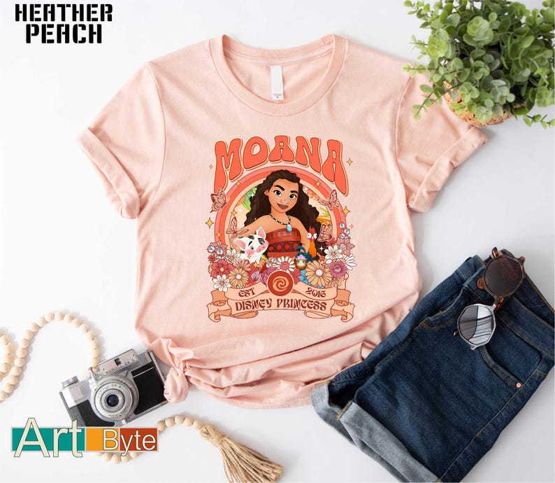 a pink shirt with a picture of moan on it
