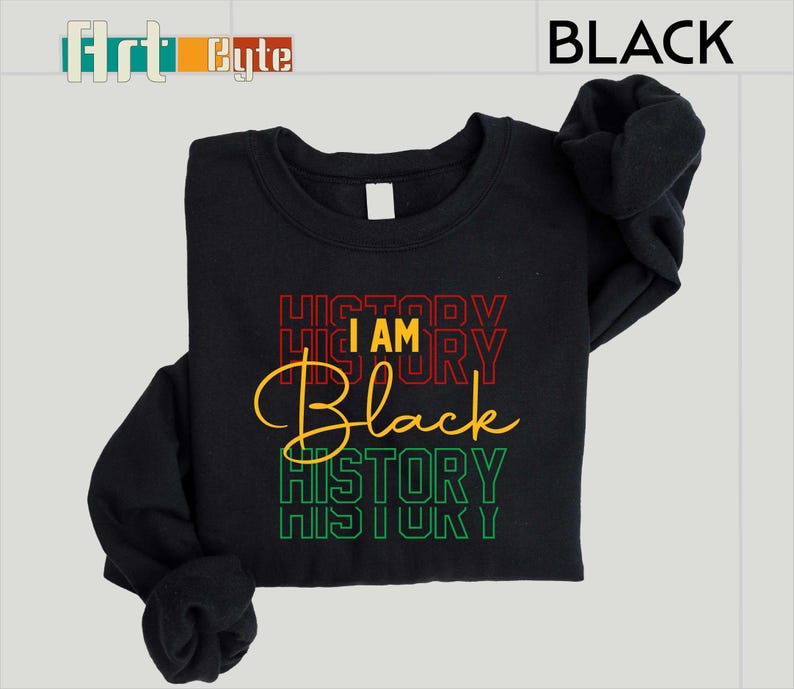 May include: Black sweatshirt with the text "I AM Black HISTORY" in red, yellow, and green. The word "BLACK" is in a bold, stylized font. The sweatshirt is black.