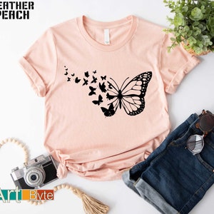 a t - shirt with a picture of a butterfly on it