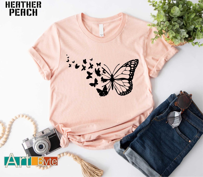 a t - shirt with a picture of a butterfly on it