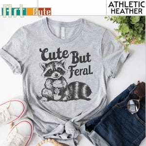 a t - shirt with a raccoon on it