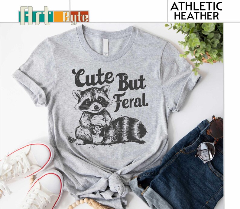 a t - shirt with a raccoon on it