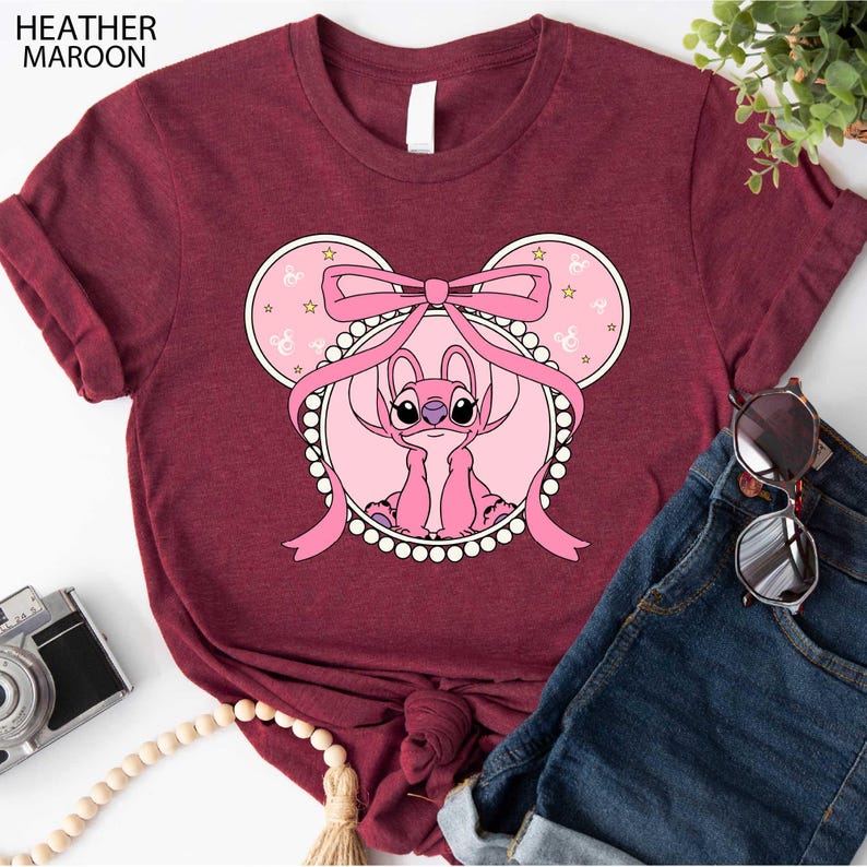 a t - shirt with a mouse wearing a pink bow