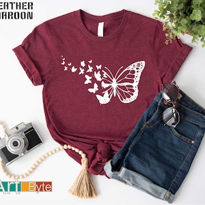 a t - shirt with a picture of a butterfly on it