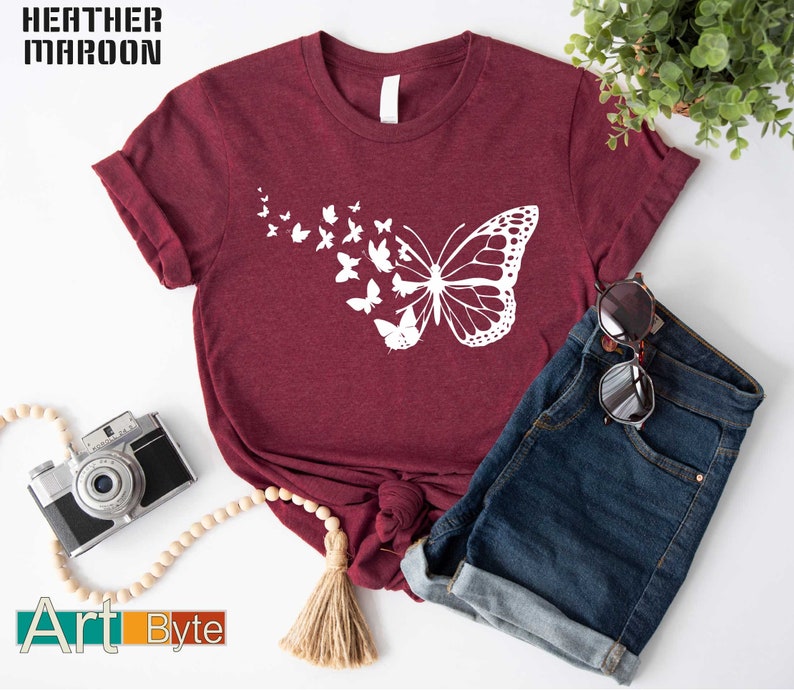 a t - shirt with a picture of a butterfly on it