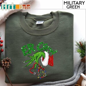 a green shirt with a green grin on it
