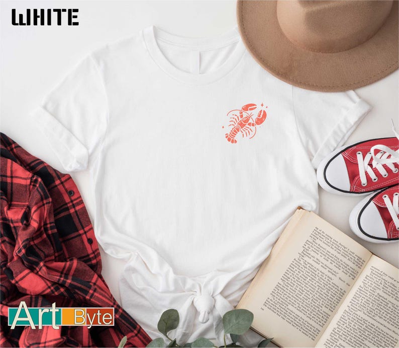 a white shirt with a red crab on it